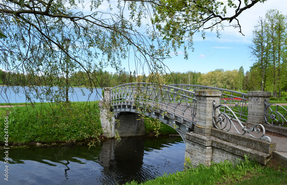Small decorative bridge on the pond in the park 