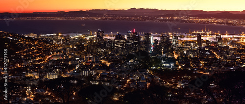 Aerial, dawn panoramic of downtown Cape Town with Table Bay in the background.