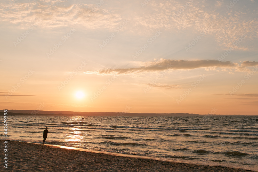 Evening landscape view of the Baltic sea. Sunset over the sea with beach