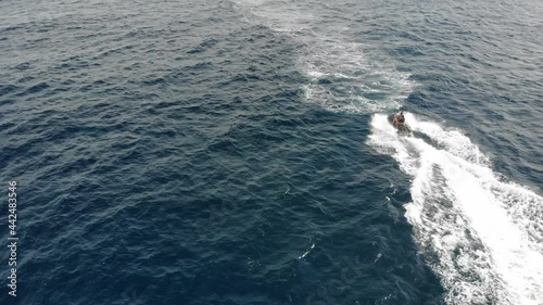Wallpaper Mural Aerial view of a hydrocycle in a deep blue colored sea	 Torontodigital.ca