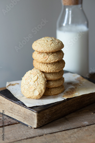 Tahini cookies on wooden table with old book 