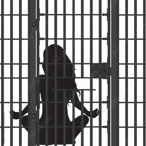 Prisoner concept. Prison bar and woman silhouette sitting in yoga pose