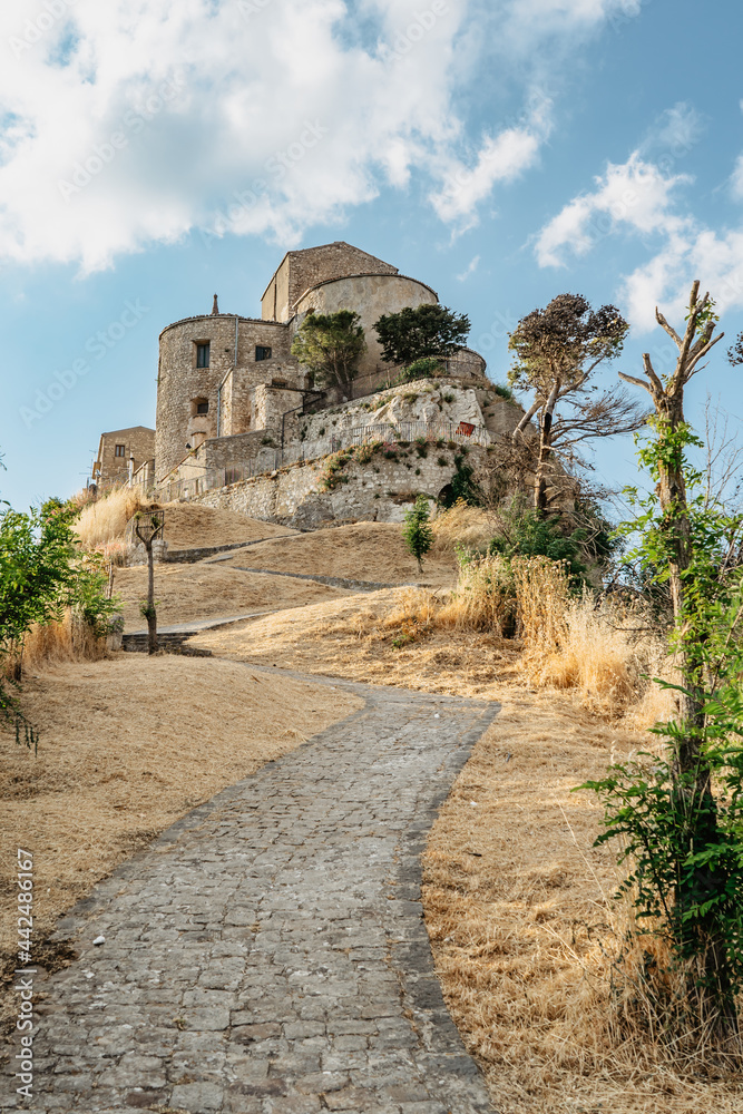 Stone village of Petralia Soprana,the highest village in Madonie mountain range,Sicily,Italy.Church of Santa Maria di Loreto at sunset.Picturesque stone houses,narrow cobbled streets,views of town