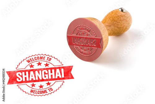 A rubber stamp on a white background - Welcome to Shanghai