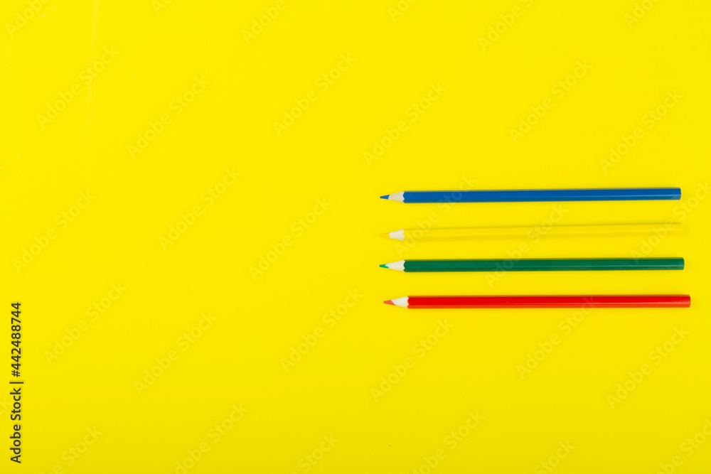 school supplies on a yellow background, top view school supplies on a yellow background, top view