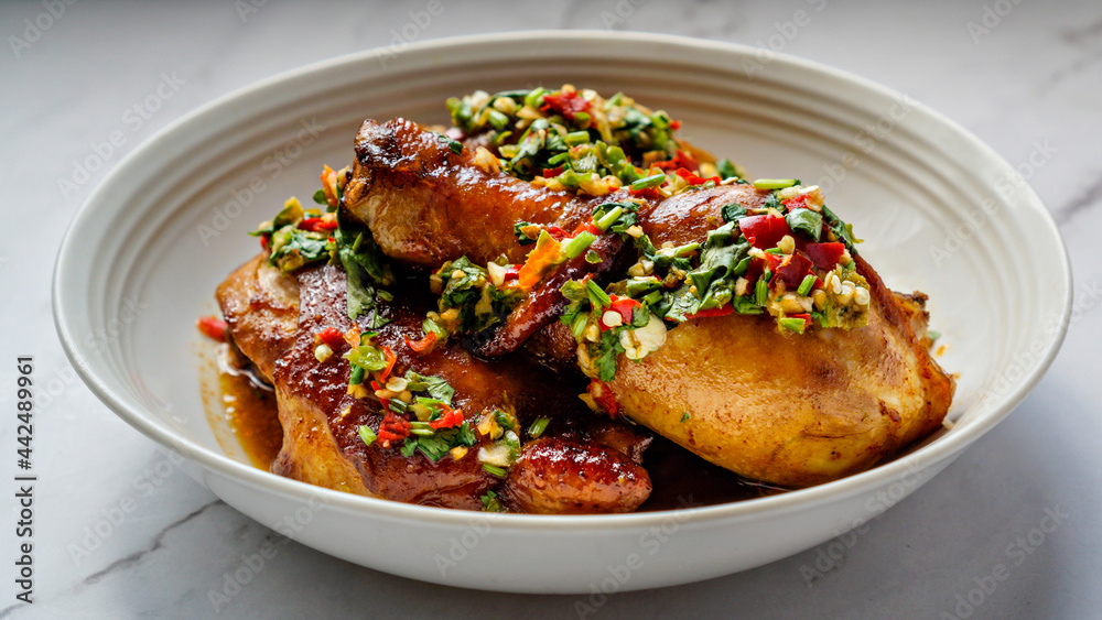 Thai Oyster chicken grilled with spicy sauce, cilantro, lime juice, red and green chillis. Thai Oyster chicken grilled with spicy sauce, cilantro, lime juice, red and green chillis.