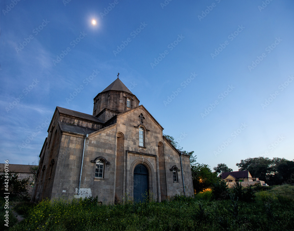 Naklejka premium Church of St. Grigoris in Nyugdi - Armenian church in Dagestan in the evening