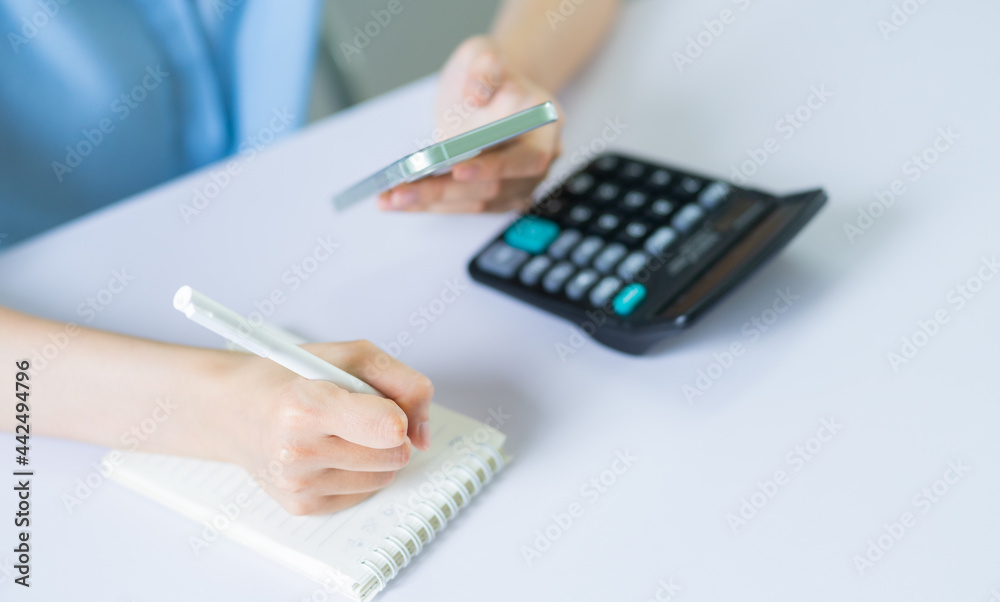 Fototapeta premium Asian woman is calculating personal income tax to pay