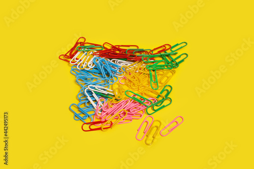 diversity of multicolored paper clips. office accessories