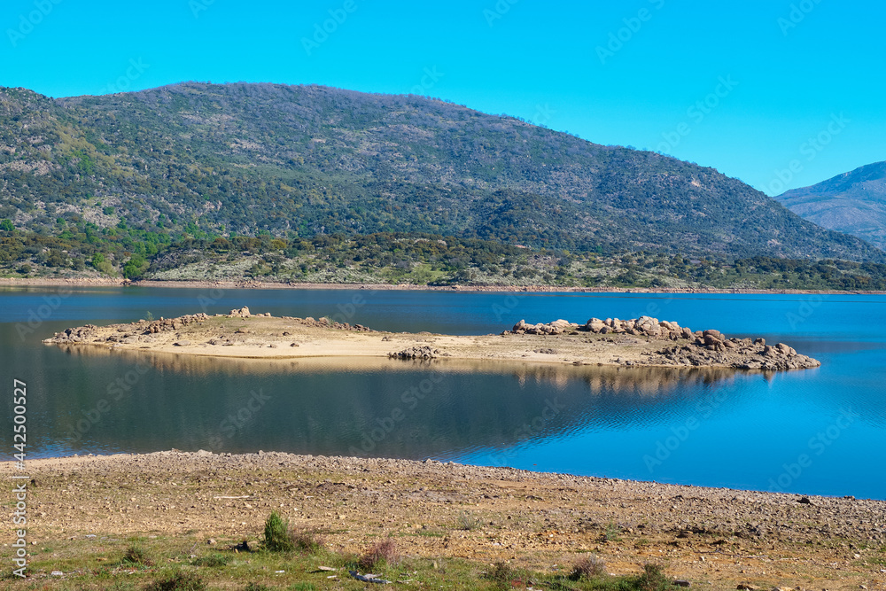 A small island in the middle of a lake