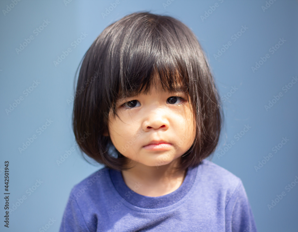 A headshot portrait of a cheerful baby Asian woman, a cute toddler little girl with adorable bangs hair, a child wearing a blue sweater smiling and looking to the camera. A headshot portrait of a cheerful baby Asian woman, a cute toddler little girl with adorable bangs hair, a child wearing a blue sweater smiling and looking to the camera.