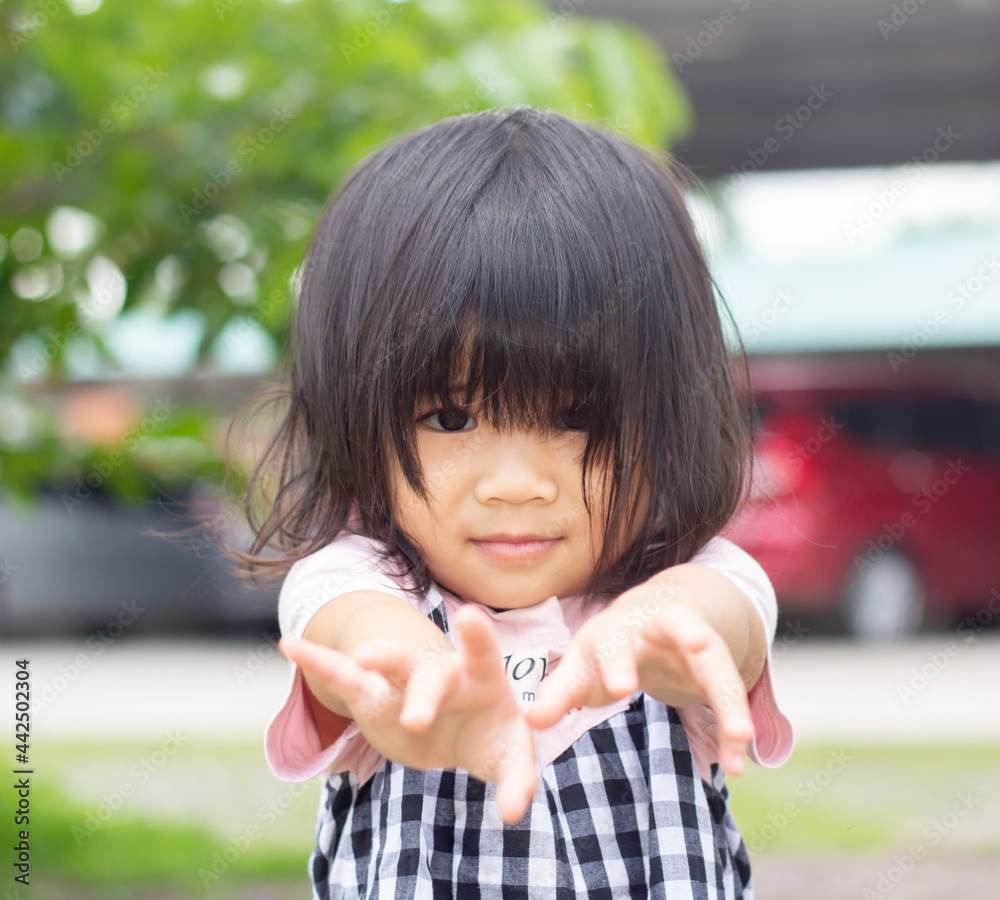 A headshot portrait of a cheerful baby Asian woman, a cute toddler little girl with adorable bangs hair, a child smiling and pose for hand a looking to the camera. A headshot portrait of a cheerful baby Asian woman, a cute toddler little girl with adorable bangs hair, a child smiling and pose for hand a looking to the camera.