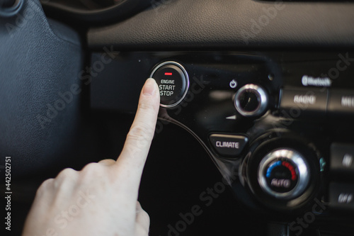 driver controls the settings of his car with buttons