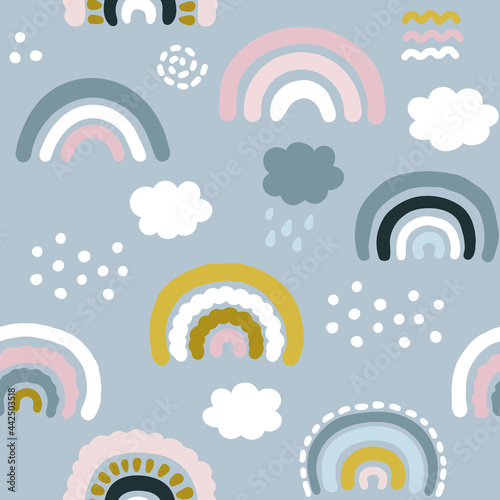 Seamless pattern with hand drawn rainbows and clouds in pastel colors. Childish print for nursery in a Scandinavian style. Kids texture for  baby clothes, fabric, textile, wallpaper, packaging.  