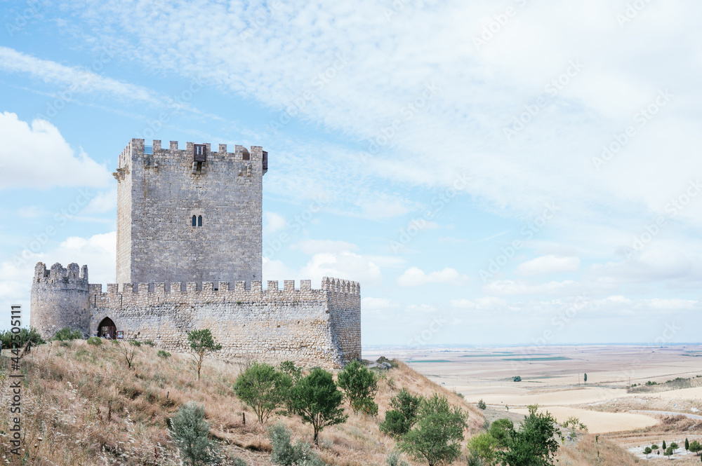 Tiedra Castle built in the 11th century with blue sky with clouds. Image with copy space