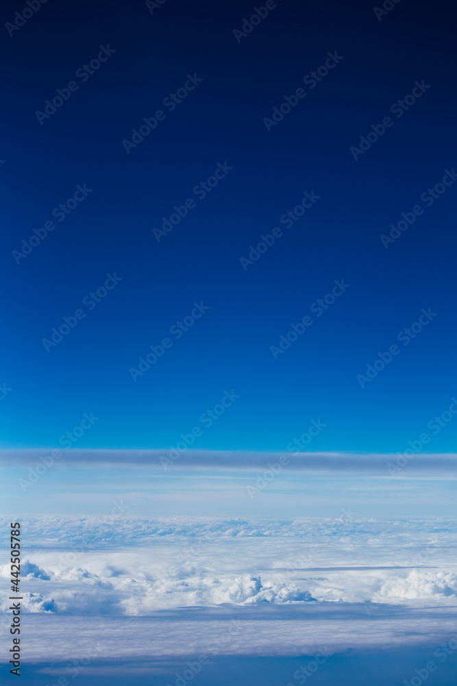 Sky and clouds from a plane vertical photo of the clouds and stratosphere Sky and clouds from a plane vertical photo of the clouds and stratosphere
