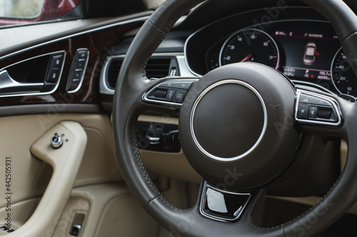 Close up of steering wheel. Car dashboard. © Hanna