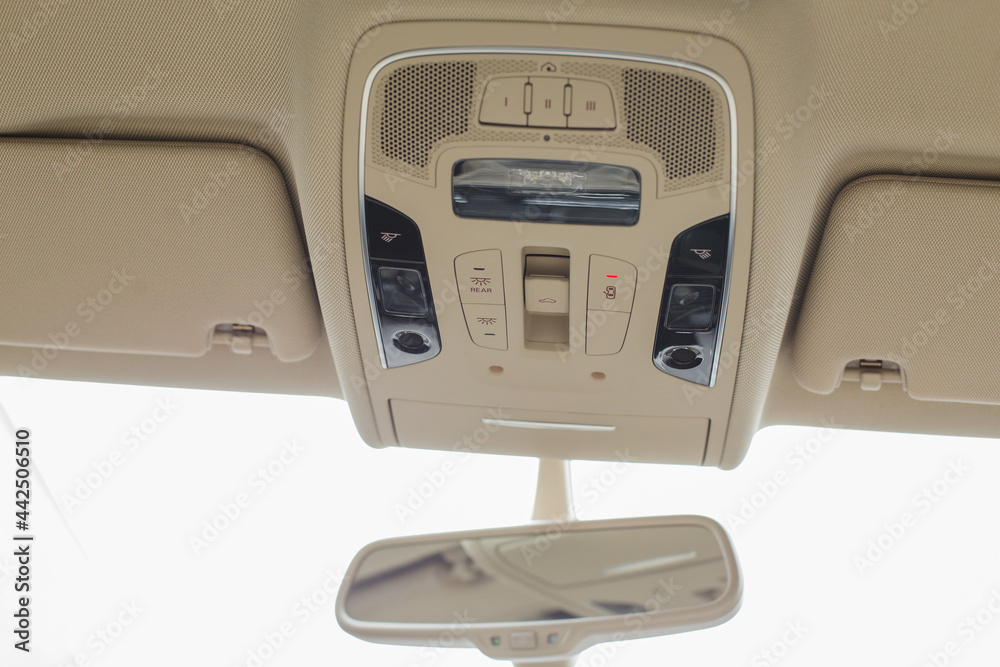 Car light panel on the top with buttons, air conditional and sun box. Car light panel on the top with buttons, air conditional and sun box.