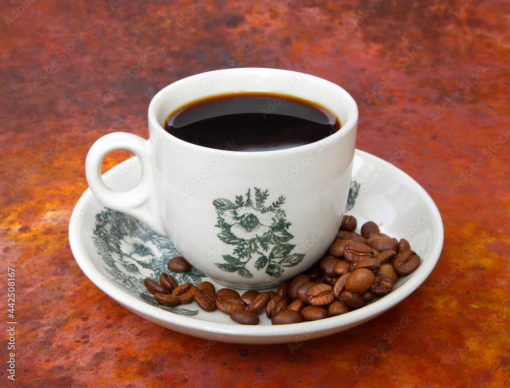 cup of coffee with beans-Traditional Kopi O commonly served in Malaysia and Singapore. cup of coffee with beans-Traditional Kopi O commonly served in Malaysia and Singapore.