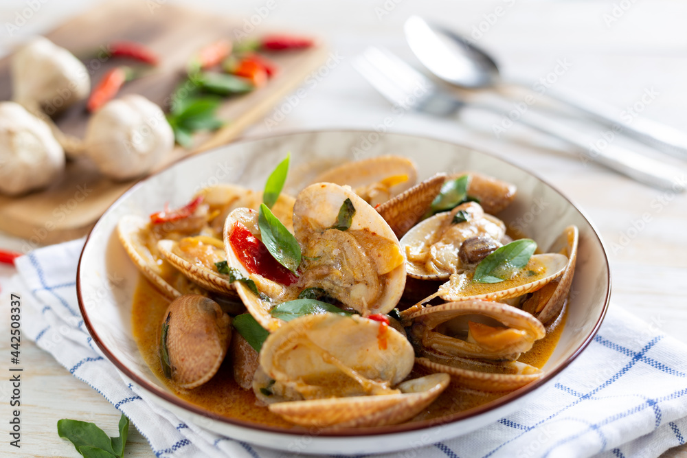 Stir-fried clams with chilli paste on the table Stir-fried clams with chilli paste on the table