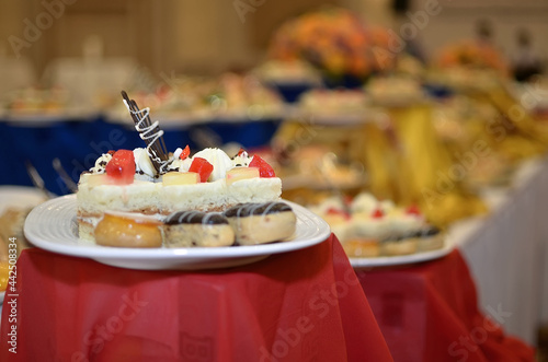 Wallpaper Mural Sweet snacks various small cakes with butter cream and chocolate on a plate on a banquet table in a restaurant Torontodigital.ca