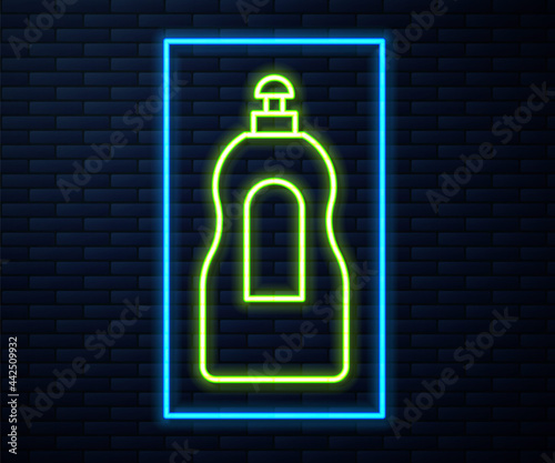Glowing neon line Dishwashing liquid bottle icon isolated on brick wall background. Liquid detergent for washing dishes. Vector