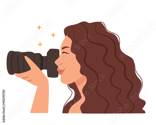 Woman photographer with camera.Beautiful female photojournalist.Model makes a photo.Woman in profile.