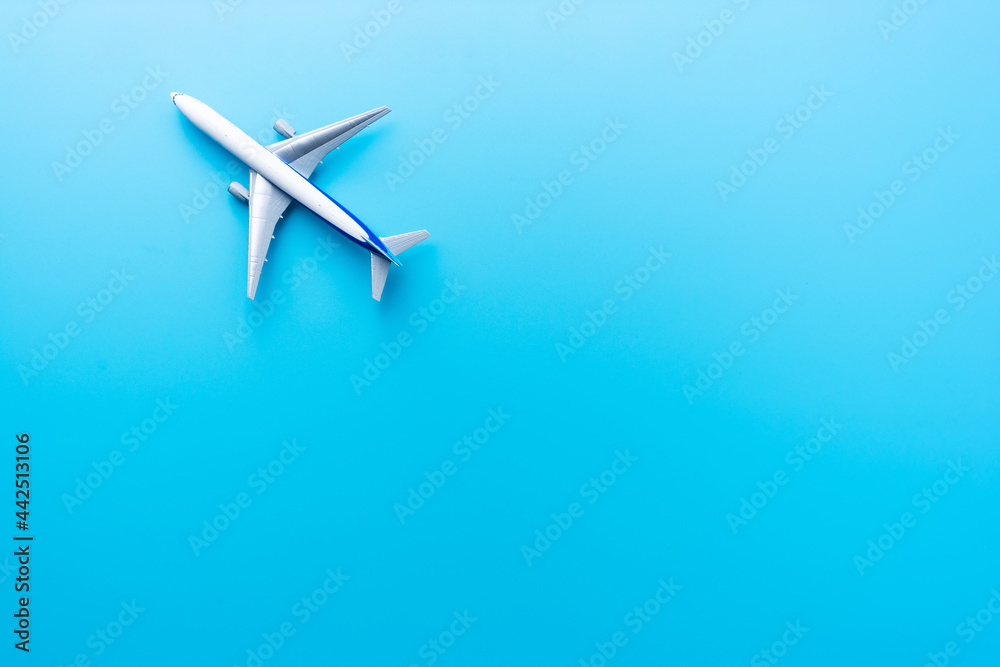 Top view of model airplane isolated on blue