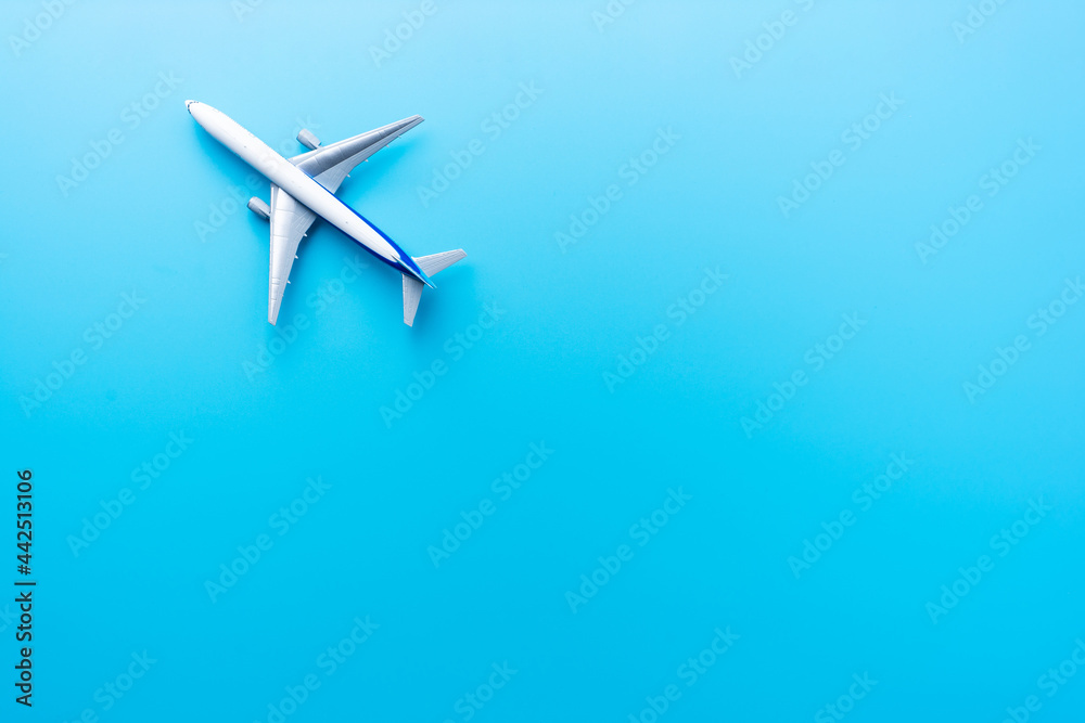 Top view of model airplane isolated on blue Top view of model airplane isolated on blue