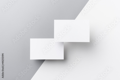 Top view of business card isolated on white & grey