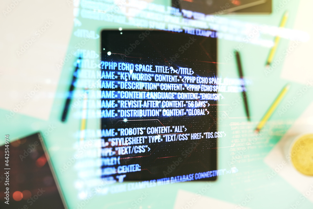 Multi exposure of abstract software development hologram and digital tablet on background, top view, research and analytics concept Multi exposure of abstract software development hologram and digital tablet on background, top view, research and analytics concept