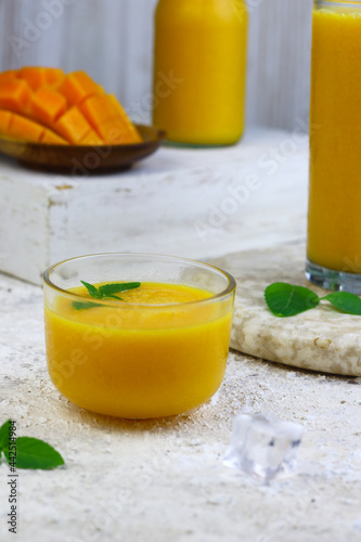 Mango Juice or jus mangga on white background. Fresh healthy during during summer holiday. 