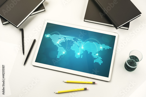 Abstract creative world map with connections on modern digital tablet screen, international trading concept. Top view. 3D Rendering