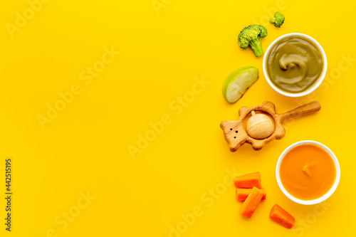 Baby feeding with fruits food and fresh vegetables, top view