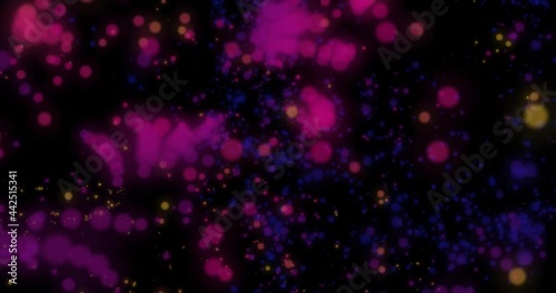Abstract particles flying. Bokeh effect. Multicolored particles fly on a black background. Horizontal composition, 4k video quality
