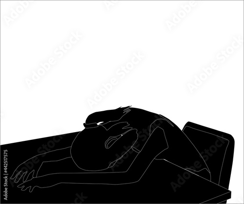 机の上に脱力する女性のシルエット