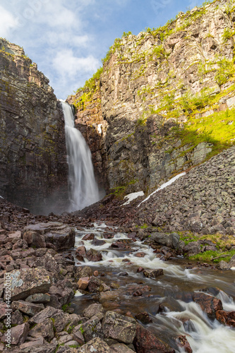 Long exposure of the highest waterfall in Sweden "Njupeskär" during summer. 