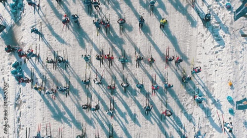 Many people on massive ski marathon long distance at winter cloudy day - Aerial drone view
