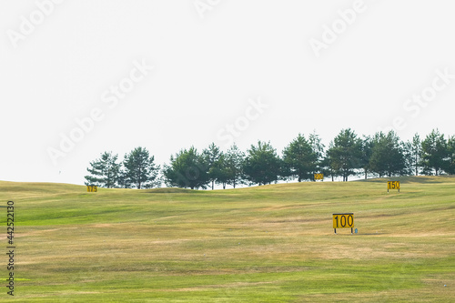 Golf course at sunset with signs