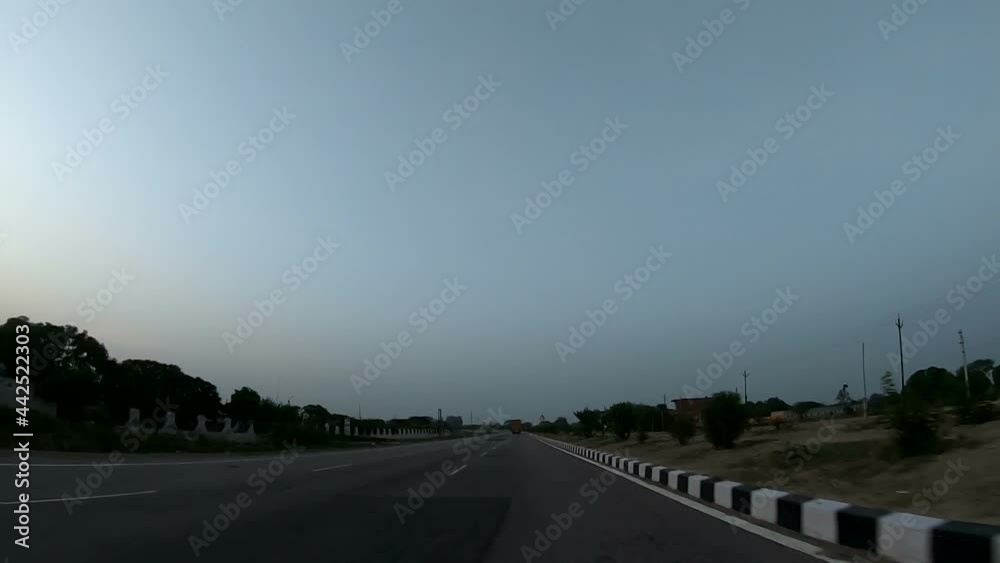 The car is running on National Highway number one. Time-lapse shooting with a camera that is mounted on the bonnet of the car. The car is running on National Highway number one. Time-lapse shooting with a camera that is mounted on the bonnet of the car.