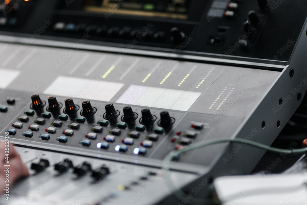 Sound mixer. Professional sound mixing console with backlight, buttons, faders and sliders. Sound mixer. Professional sound mixing console with backlight, buttons, faders and sliders.