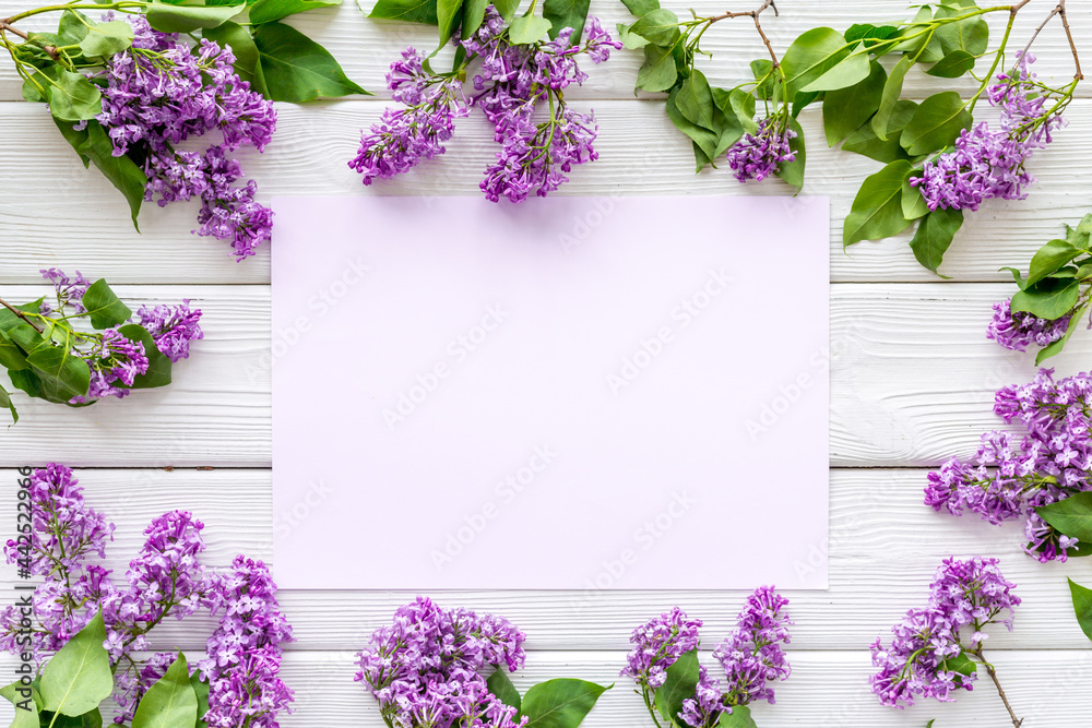 Purple spring flowers background. Lilac branches flat lay Purple spring flowers background. Lilac branches flat lay