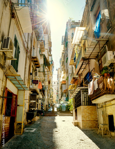 Narrow street in old town of Naples city in Italy