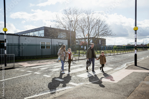 Family Safely Crossing the Road