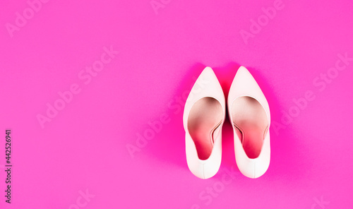 High heel women shoes on pink background. Shoe for women. Beauty and fashion concept. Fashionable women shoes isolated on red background. Stylish classic women leather shoe