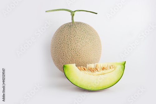 green melon fruit on white background