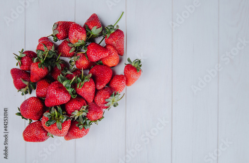 top view of fresh ripe strawberries isolated on white background with copy space