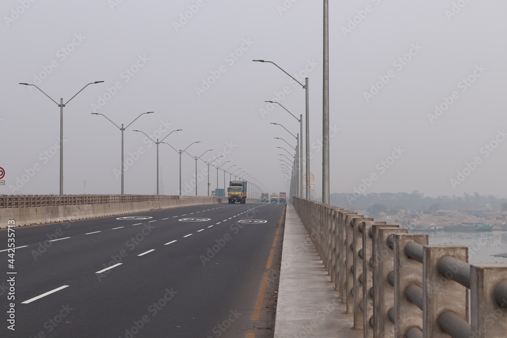 Transport safety concept. Traffic on the bridge. highway bridge on the river in bangladesh
