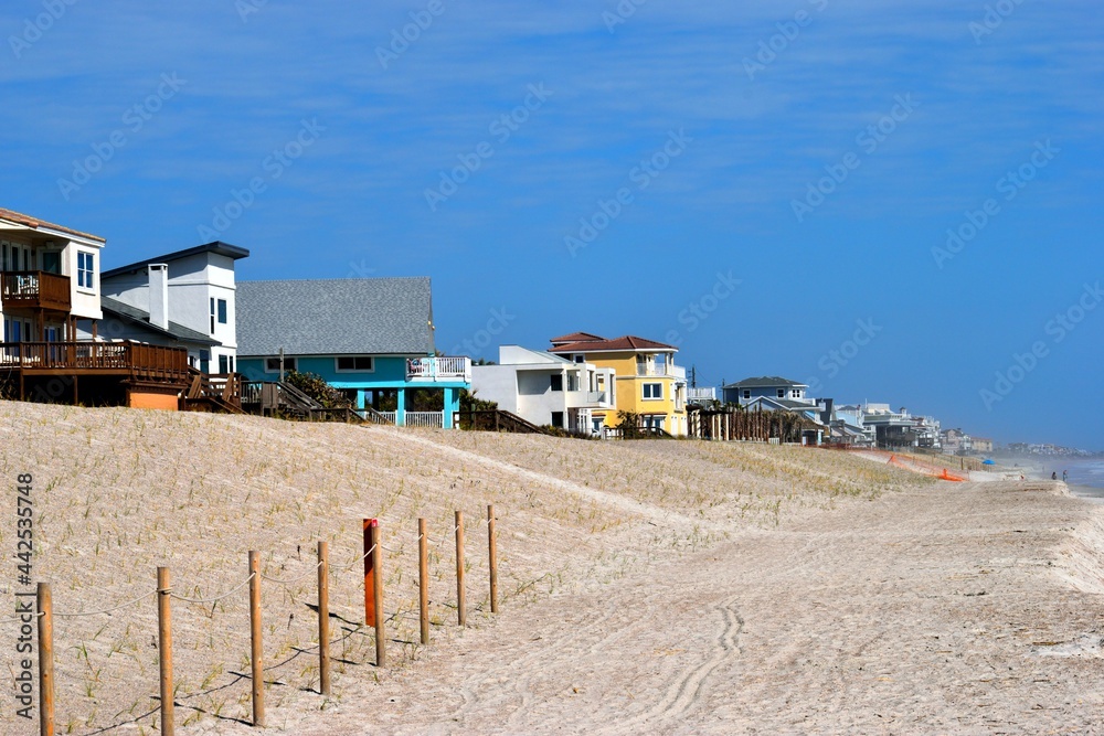 Homes on the ocean beach background landscape.