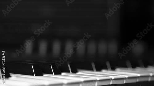 Obraz na plátně Piano keys on black background